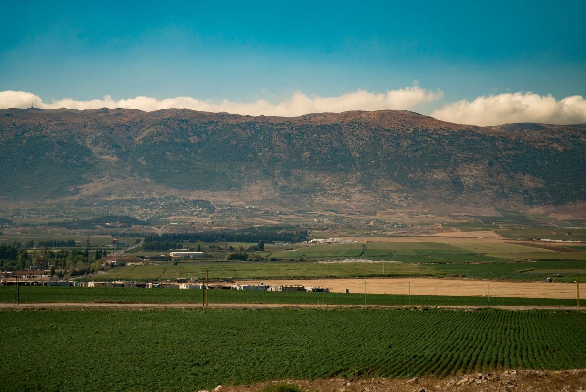 A refugee camp sits among agriculture fields in the Bekaa Valley, Lebanon.