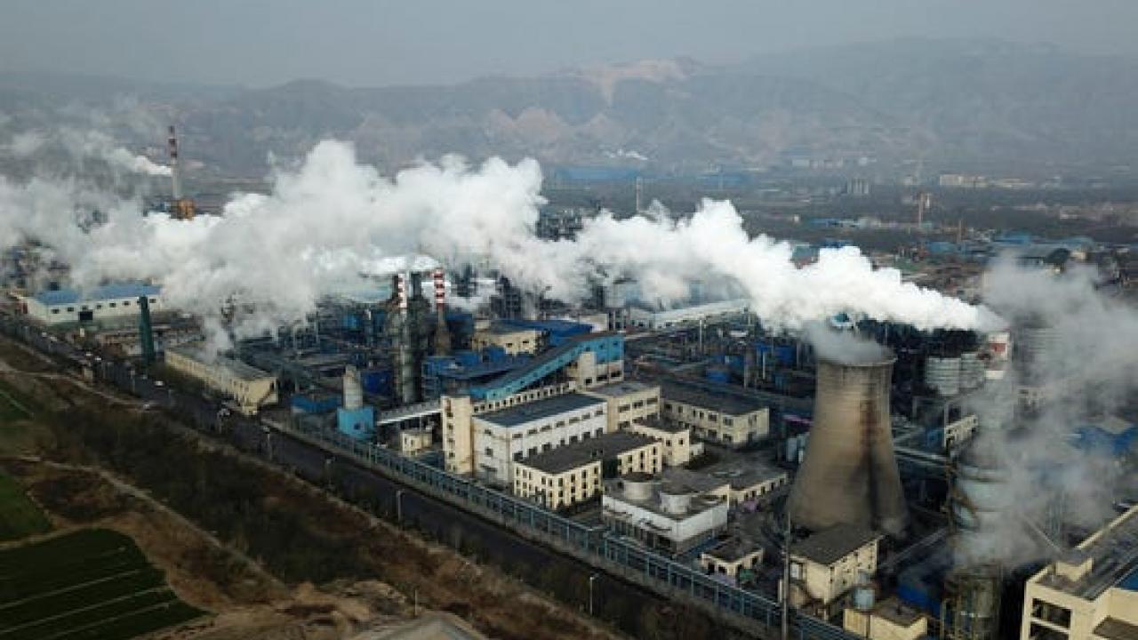 In this Nov. 28, 2019, file photo, smoke and steam rise from a coal processing plant in Hejin in central China's Shanxi Province