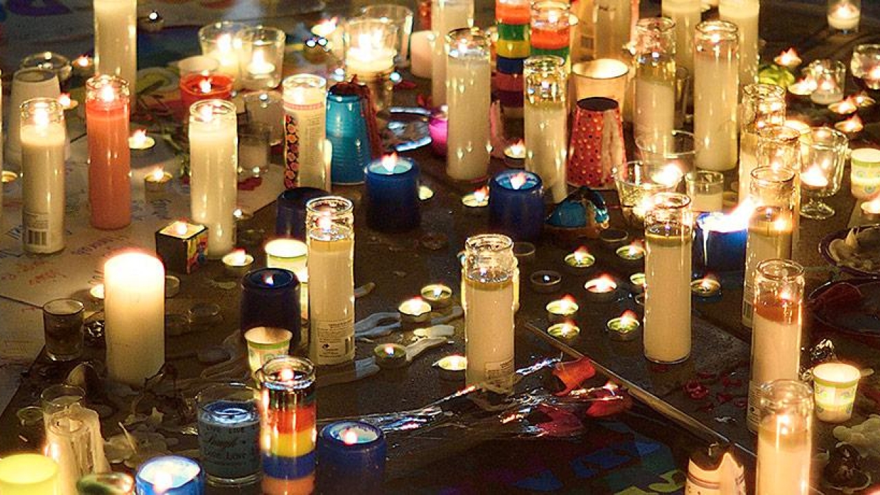 Candlelight vigil image highlights and remembers the victims of violence. 