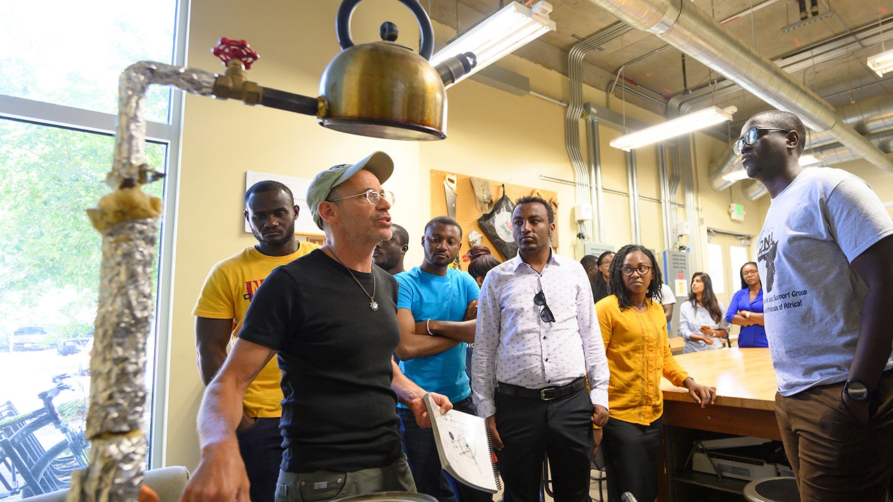 Kurt Kornbluth talking with a group of Mandela Fellows