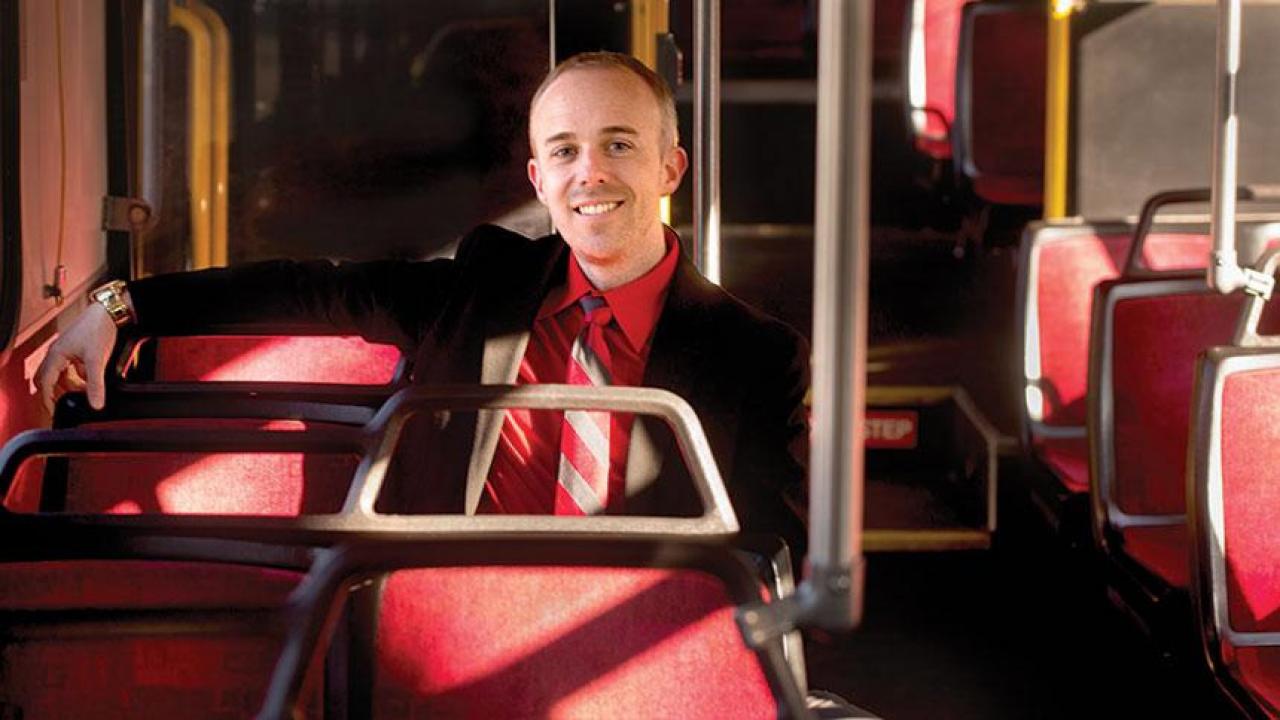 Jeff Flynn sits on a Unitrans bus
