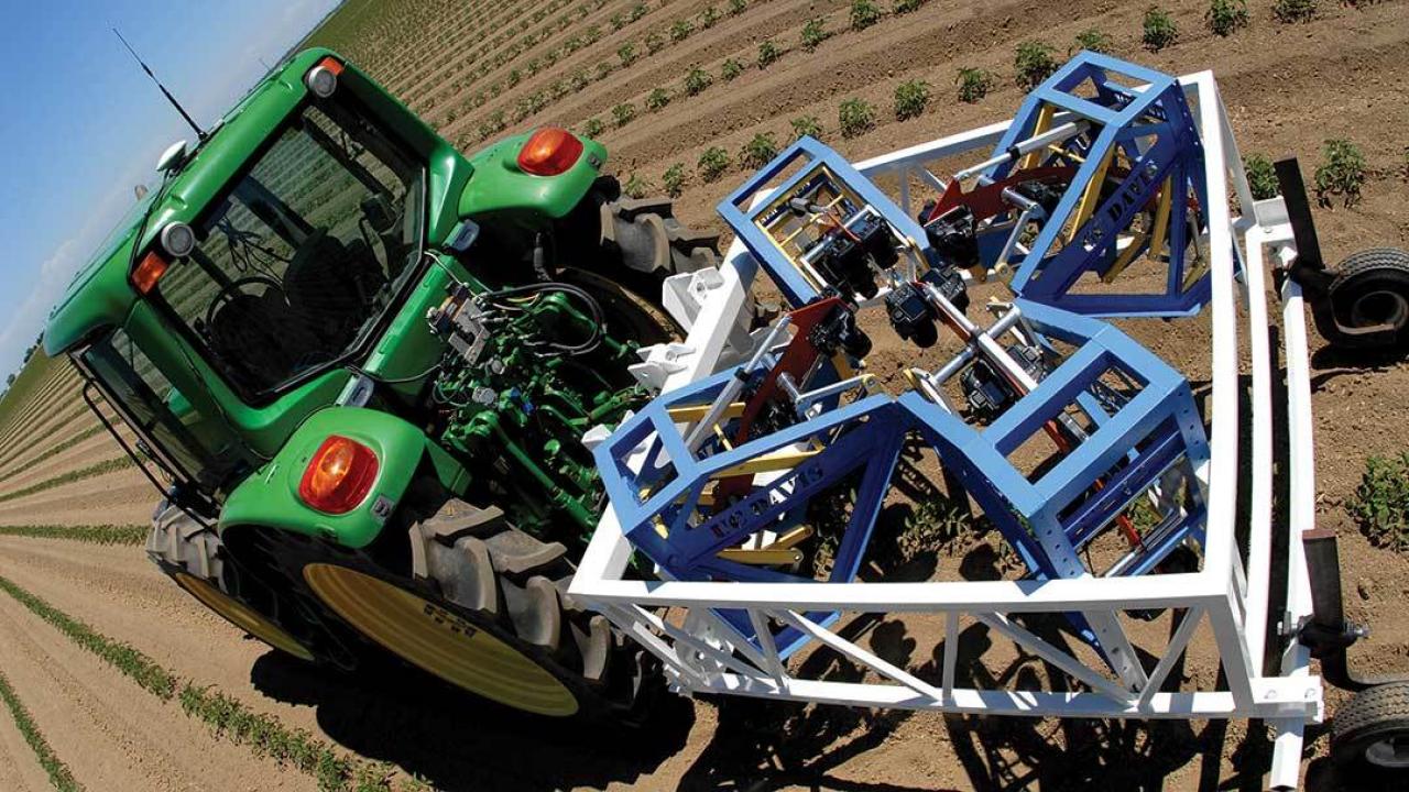 A UC Davis team has built a phenotyping machine that is towed behind a tractor.
