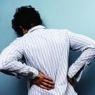Man experiencing back pain 