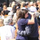 People hugging in a crowd
