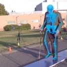 Two people doing a trial outside with sensors set up and a blue and orange skeletons obscuring the subjects.