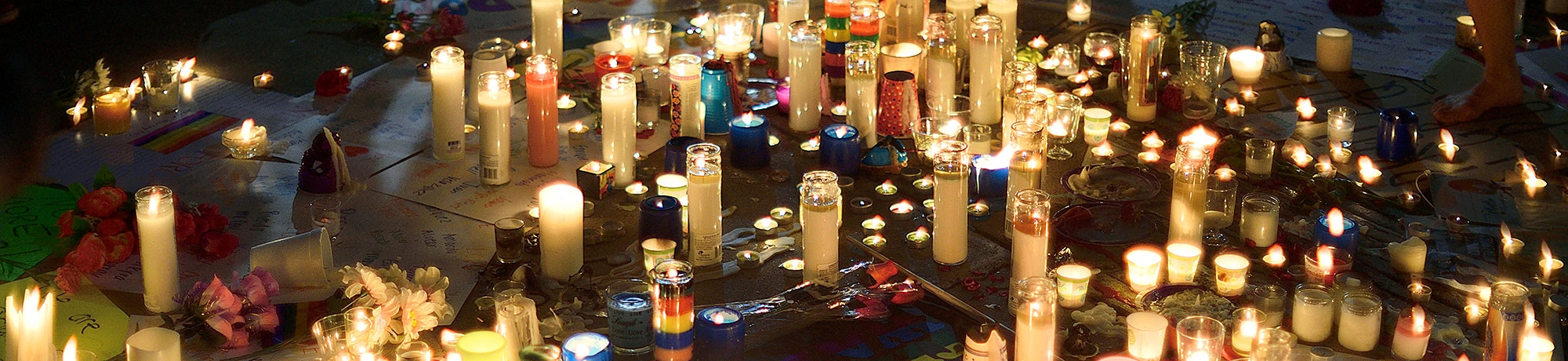 Candlelight vigil image highlights and remembers the victims of violence. 