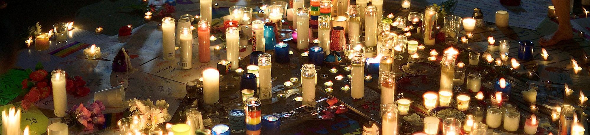 Candlelight vigil image highlights and remembers the victims of violence. 